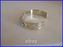 Wigwam Traders 5-Turquoise Stone Cuff with Snakes by artist Effie CalavazaK1848