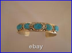 Wigwam Traders 5-Turquoise Stone Cuff with Snakes by artist Effie CalavazaK1848